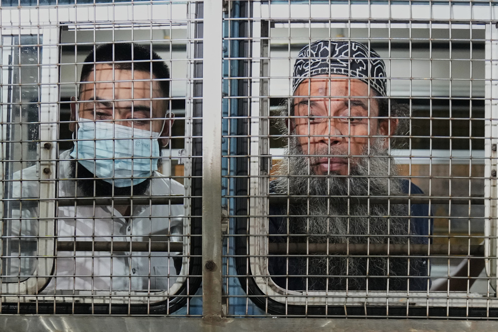 Unidentified men convicted for their involvement in the 2019 Easter bombings are escorted to a prison in Colombo, Wednesday, Sept. 23, 2026. (AP Photo/Eranga Jayawardena)
