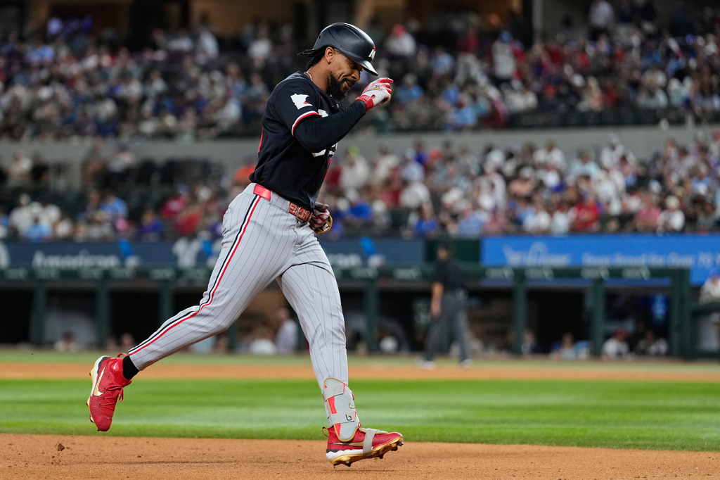 Minnesota Twins' Byron Buxton rounds the bases after hitting a solo home run in the sixth inning of a baseball game against the Texas Rangers in Arlington, Texas, Monday, June 15, 2026. (AP Photo/Tony Gutierrez)