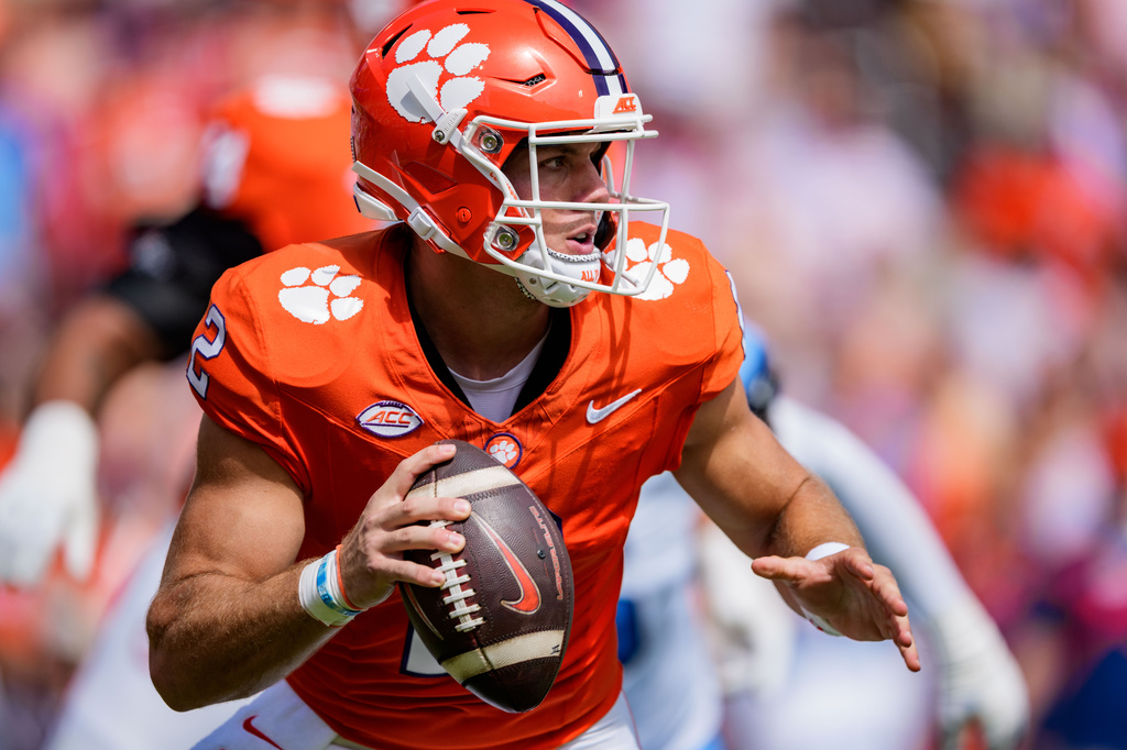Clemson quarterback Tait Reynolds looks to pass against North Carolina in the first half of an NCAA college football game Saturday, Sept. 19, 2026, in Clemson, S.C. (AP Photo/Jacob Kupferman)