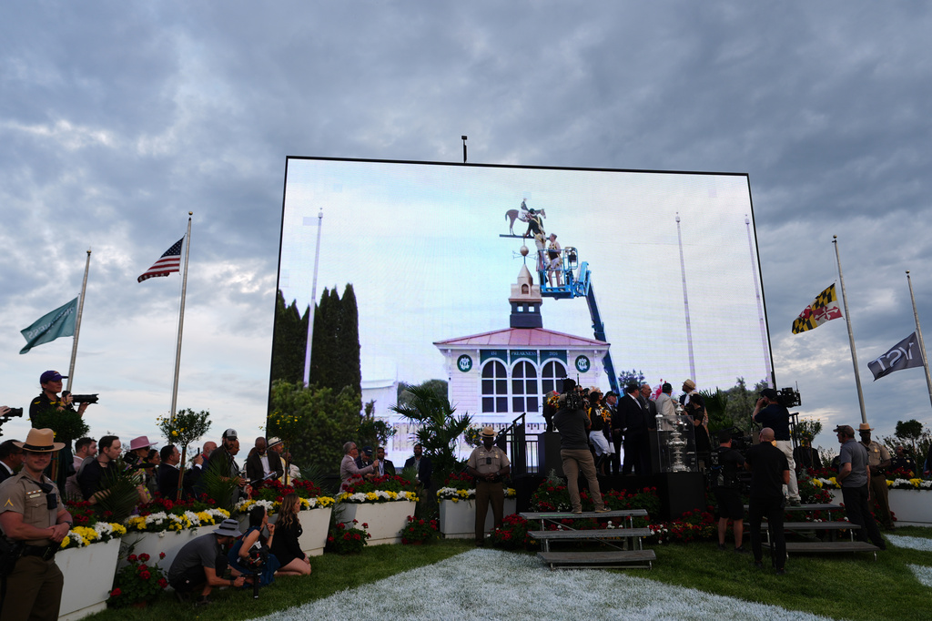 FILE - A broadcast shows staff painting the new colors of Paco Lopez and Napoleon Solo on the Pimlico weather vane after they won the 151st running of the Preakness Stakes horse race, May 16, 2026, at Laurel Park in Laurel, Md. (AP Photo/Julia Demaree Nikhinson, File)