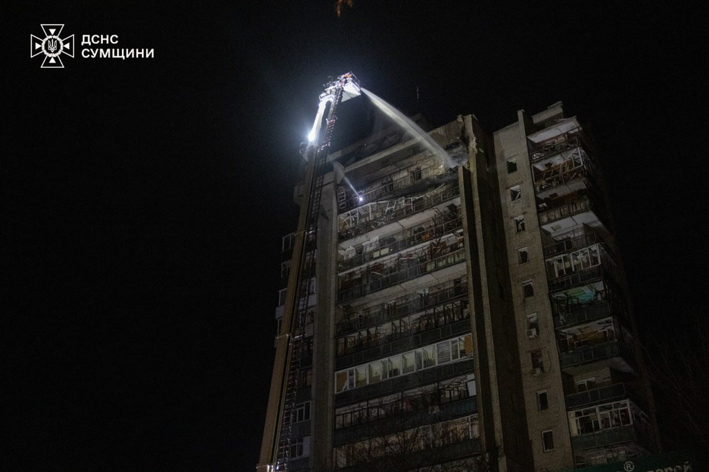 In this photo provided by the Ukrainian Emergency Services on Saturday, April 4, 2026, rescue workers put out a fire of a residential building damaged following a Russian strike in Sumy, Ukraine. (Ukrainian Emergency Service via AP)