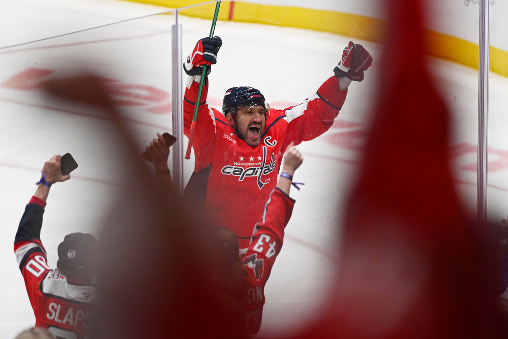 Washington Capitals left wing Alex Ovechkin (8) celebrates his 900th NHL career goal against the St. Louis Blues during the second period of an NHL hockey game, Wednesday, Nov. 5, 2025, in Washington. (AP Photo/John McDonnell)