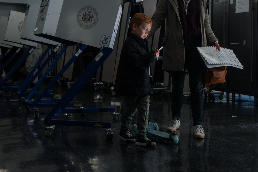 People vote on Election Day on Tuesday, Nov. 4, 2025, in New York. (AP Photo/Olga Fedorova)