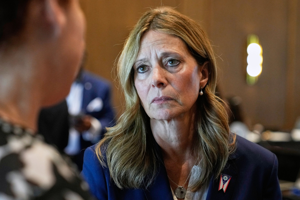 FILE - Amy Acton, Democratic candidate for Governor of Ohio, talks with people during a break in a conference in Columbus, Ohio, April 15, 2026. (AP Photo/Sue Ogrocki, File)