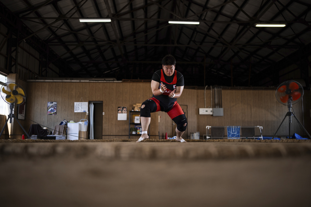 Airi Hisano trains during a practice session at the Tachihi Holdings Women's sumo club in Tokyo, on Aug. 2, 2025. (AP Photo/Louise Delmotte)