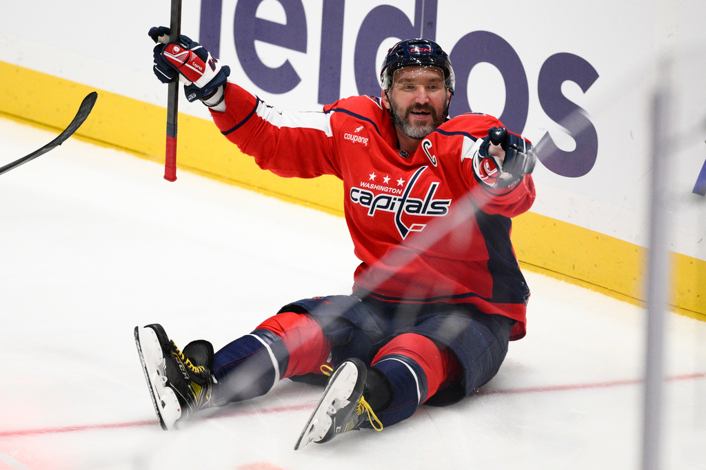 Washington Capitals left wing Alex Ovechkin (8) celebrates his goal during the third period of an NHL hockey game against the Philadelphia Flyers, left, Tuesday, March 31, 2026, in Washington. (AP Photo/Nick Wass)