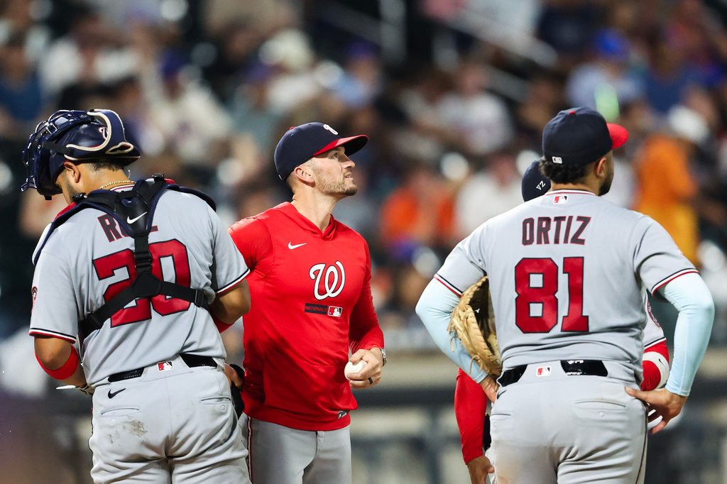 Washington Nationals manager Blake Butera looks on during a pitching change in the seventh inning of a baseball game against the New York Mets, Friday, Aug. 14, 2026, in New York. (AP Photo/Heather Khalifa)