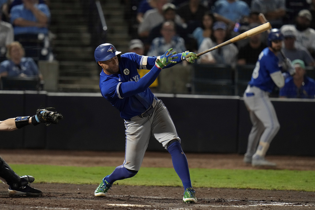 Toronto Blue Jays' George Springer hits an RBI single off Tampa Bay Rays pitcher Kevin Kelly during the 11th inning of a baseball game Monday, Sept. 15, 2025, in Tampa, Fla. (AP Photo/Chris O'Meara)