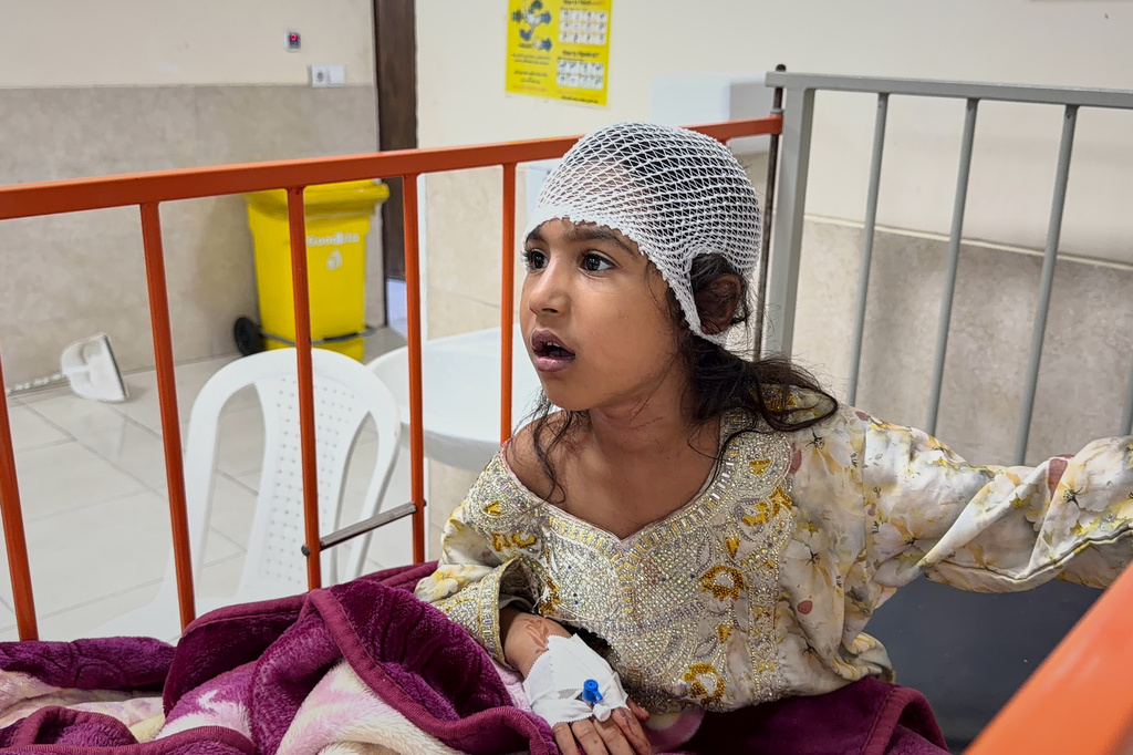 A child wounded, according to Tasnim news agency, in a strike on a home where a wedding was being held in Kuhestak, southern Iran, receives treatment at a hospital in Menab, Iran, early Wednesday, Sept.2, 2026. (Morteza Akhoondi/Tasnim News Agency via AP)