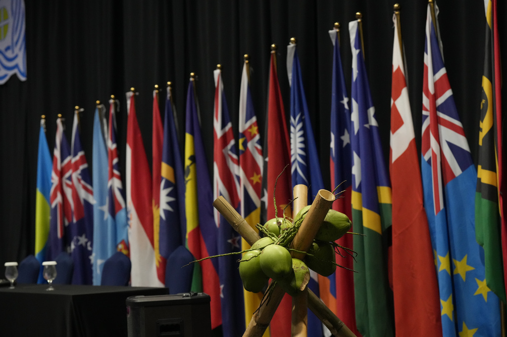 Flags of Pacific Island nations are displayed ahead of a news conference by leaders at the Pacific Islands Forum Leaders Meeting in Koror, Palau, Thursday, Sept. 3, 2026. (AP Photo/Charlotte Graham-McLay)