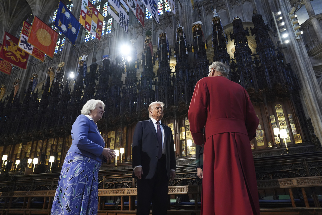 President Donald Trump and first lady Melania Trump receive a tour of St. George's Chapel at Windsor Castle, Windsor, England, Wednesday, Sept. 17, 2025. (AP Photo/Evan Vucci, Pool)