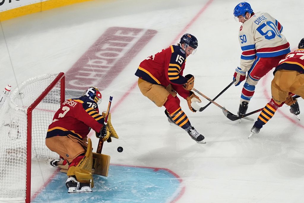 Florida Panthers goaltender Sergei Bobrovsky (72) blocks a shot attempt by the New York Rangers during the first period of the NHL Winter Classic outdoor hockey game, Friday, Jan. 2, 2026, in Miami. (AP Photo/Rebecca Blackwell)