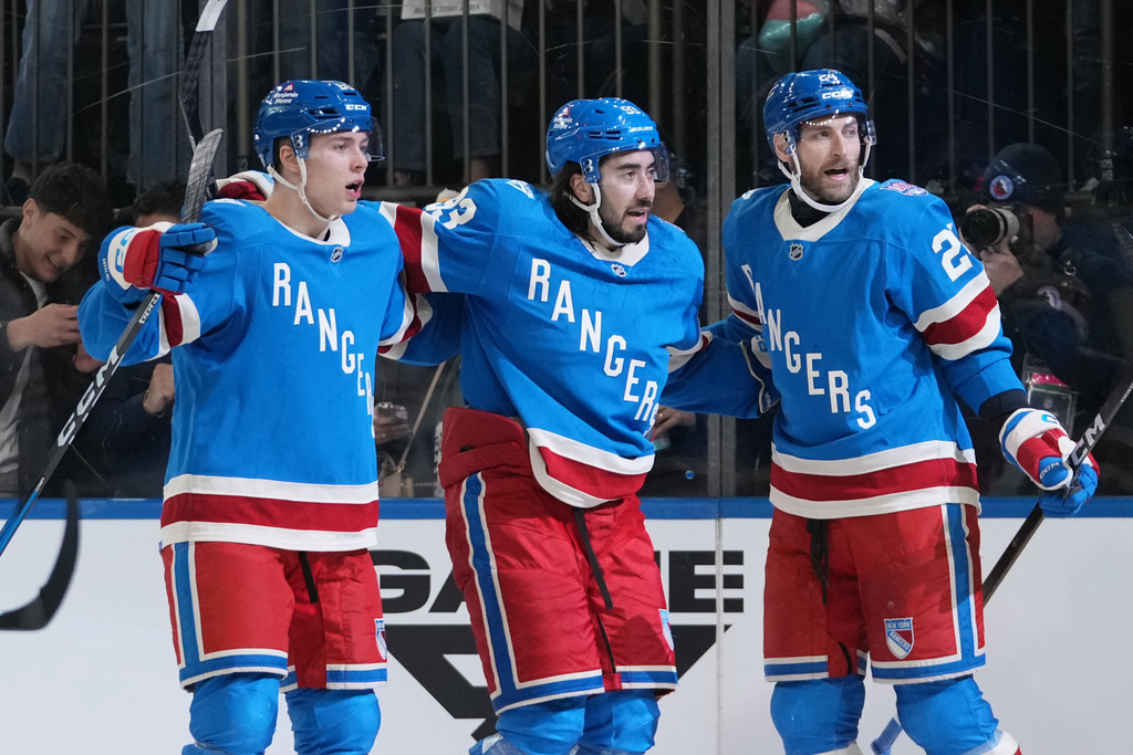 New York Rangers' Mika Zibanejad, center, celebrates with teammates Carson Soucy, right, and Scott Morrow after scoring a goal during the second period of an NHL hockey game against the Buffalo Sabres Thursday, Jan. 8, 2026, in New York. (AP Photo/Frank Franklin II)