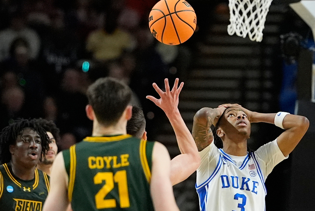Duke guard Isaiah Evans (3) reacts to a foul during the first half in the first round of the NCAA college basketball tournament against Siena, Thursday, March 19, 2026, in Greenville, S.C. (AP Photo/Brynn Anderson)