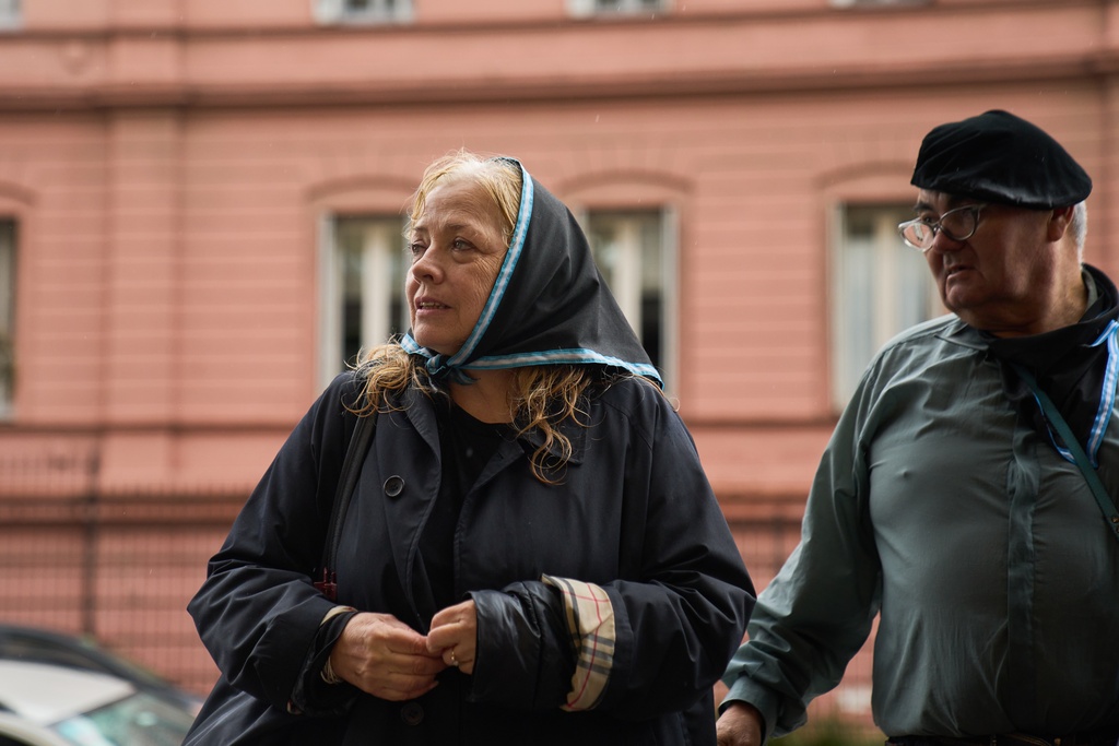 Asuncion Benedit, left, takes part in a protest demanding the release of former servicemen accused of human rights violations during the last dictatorship, in Buenos Aires, Argentina, Saturday, Nov. 29, 2025. (AP Photo/Rodrigo Abd)