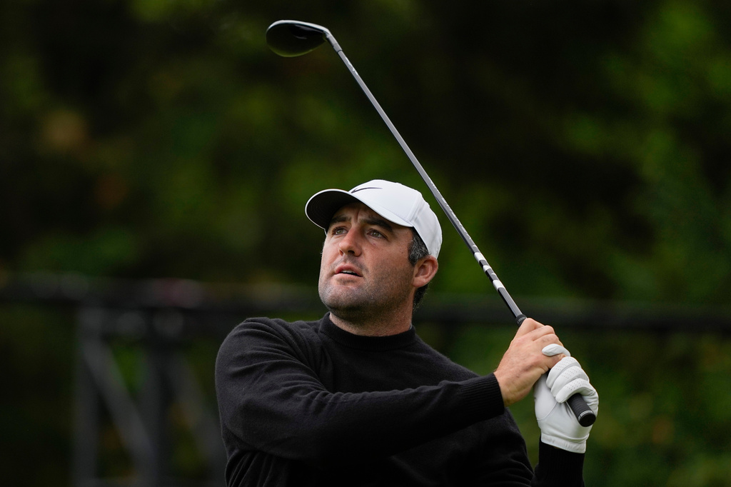 Scottie Scheffler hits from the 13th tee during the second round of the PGA Championship golf tournament at Aronimink Golf Club, Friday, May 15, 2026, in Newtown Square, PA. (AP Photo/Carolyn Kaster)