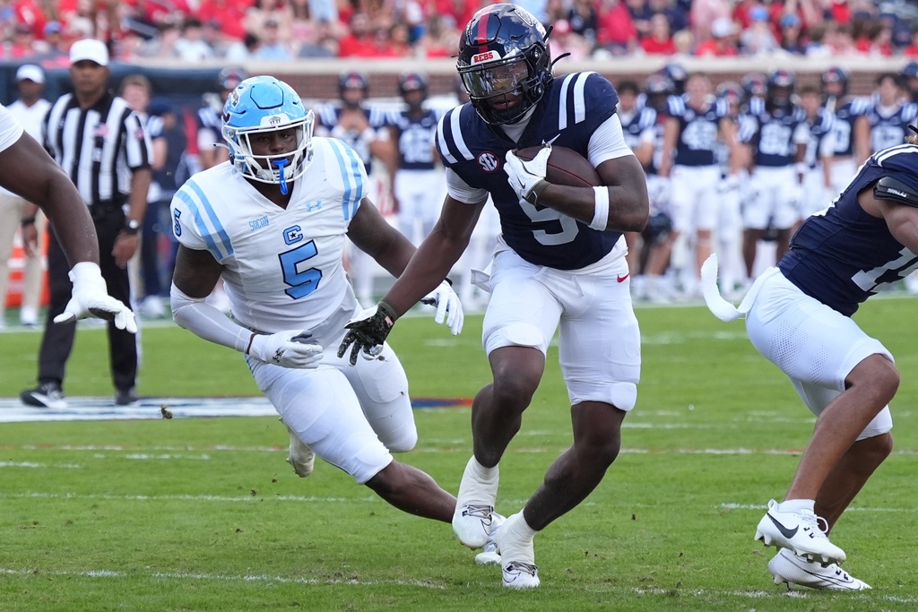 Mississippi running back Kewan Lacy (5) runs past The Citadel linebacker Je'Mazin Roberts (5) for a first down during the first half of an NCAA college football game, Saturday, Nov. 8, 2025, in Oxford, Miss. (AP Photo/Rogelio V. Solis)