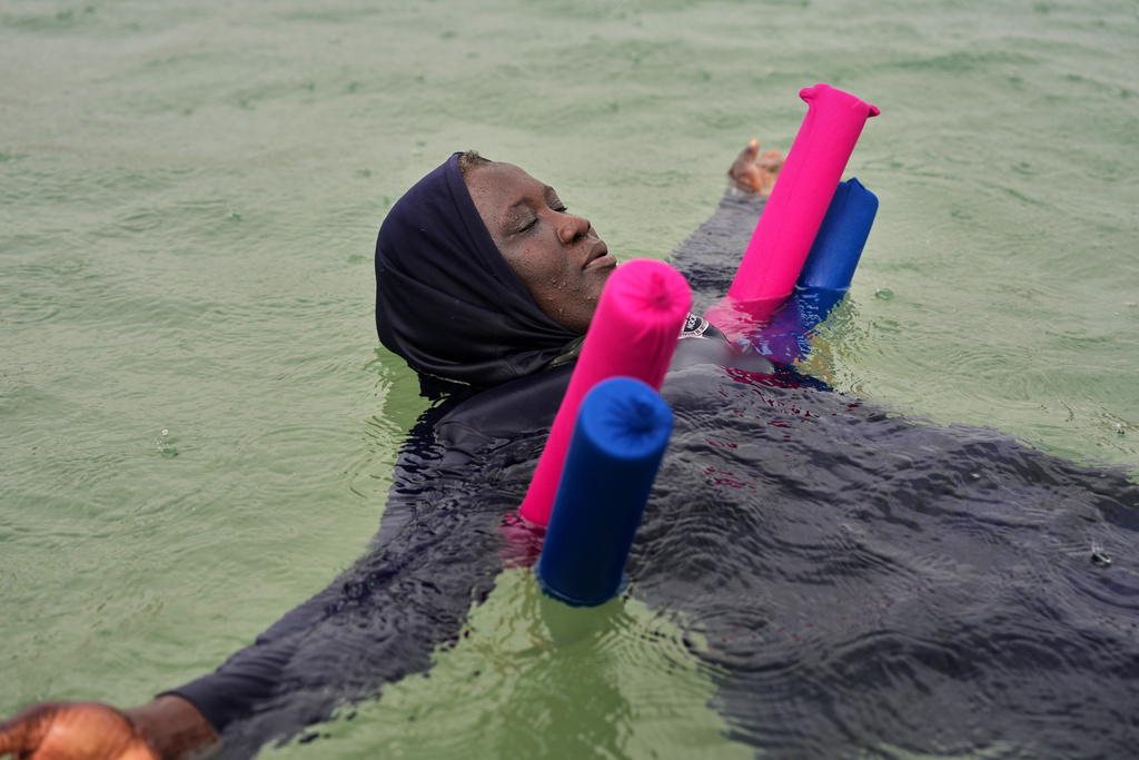 FILE - A participant floats during an aquatic therapy session in the ocean in Dakar, Senegal, Saturday, Dec. 6, 2025. (AP Photo/Misper Apawu, File)