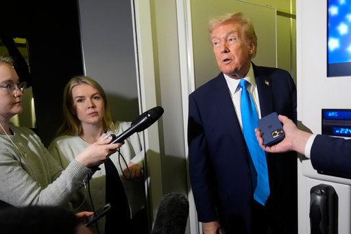 President Donald Trump speaks with reporters as White House press secretary Karoline Leavitt, second left, listens, aboard Air Force One at Al Udeid Air Base in Doha, Qatar, Saturday, Oct. 25, 2025. (AP Photo/Mark Schiefelbein) President Donald Trump speaks with reporters as White House press secretary Karoline Leavitt, second left, listens, aboard Air Force One at Al Udeid Air Base in Doha, Qatar, Saturday, Oct. 25, 2025. (AP Photo/Mark Schiefelbein)