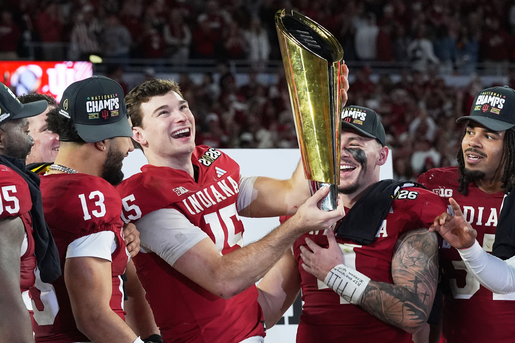 Indiana quarterback Fernando Mendoza holds the trophy after their win against Miami in the College Football Playoff national championship game, Monday, Jan. 19, 2026, in Miami Gardens, Fla. (AP Photo/Marta Lavandier)
