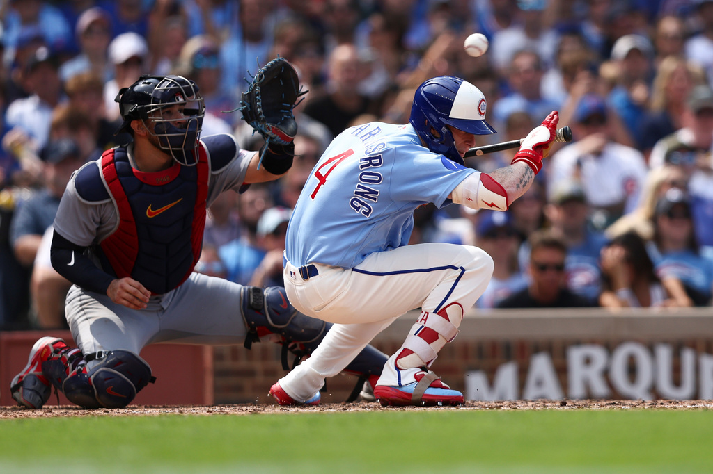 Chicago Cubs' Pete Crow-Armstrong (4) ducks below a pitch as St. Louis Cardinals catcher Iván Herrera, left, waits to catch the ball during the sixth inning of a baseball game in Chicago, Friday, Aug. 14, 2026. (AP Photo/Jessie Alcheh)