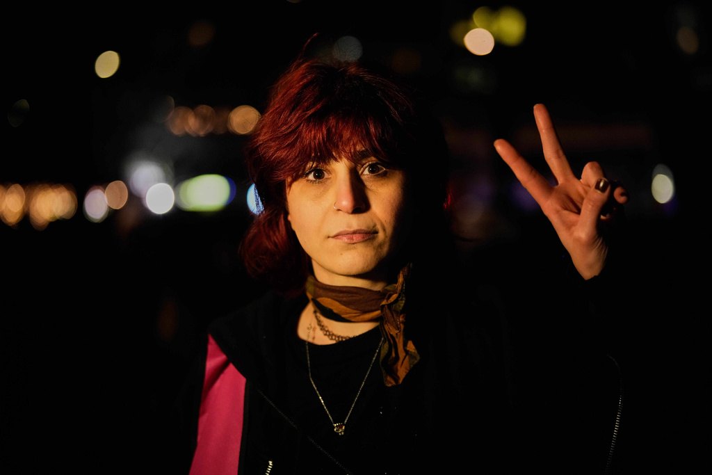 Iranian Maryam Nejatipur 32, poses for a photo after a demonstration in support of the nationwide mass protests in Iran against the government, in Berlin, Germany, Wednesday, Jan. 14, 2026. (AP Photo/Ebrahim Noroozi)