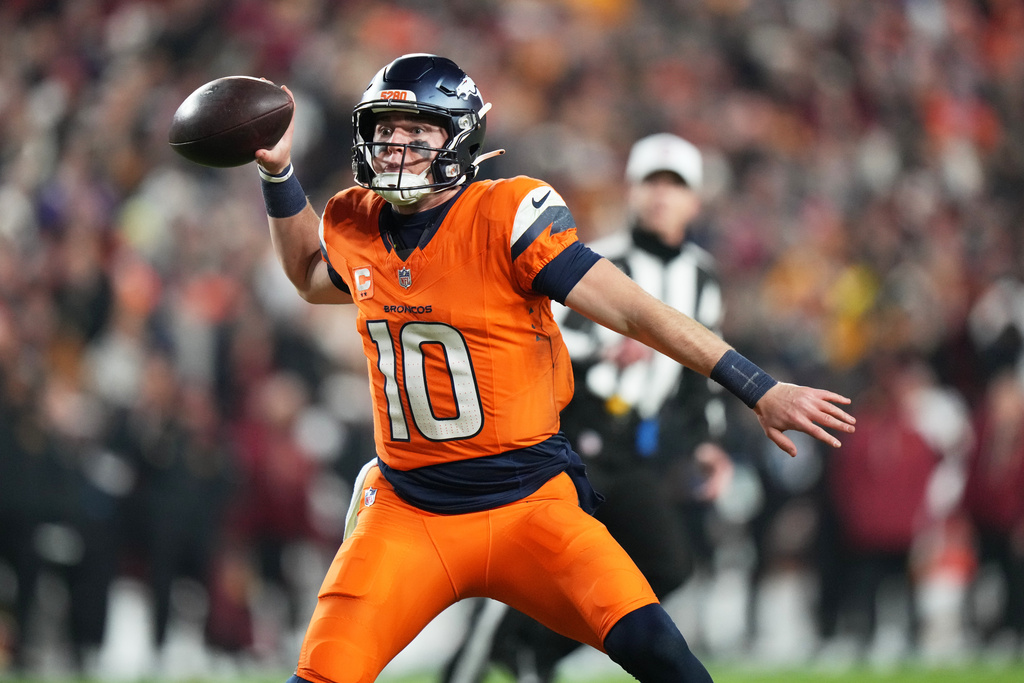 Denver Broncos quarterback Bo Nix looks to pass during the first half of an NFL football game against the Washington Commanders Sunday, Nov. 30, 2025, in Landover, Md. (AP Photo/Stephanie Scarbrough)