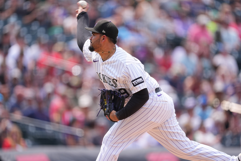 Colorado Rockies relief pitcher Antonio Senzatela works against the Boston Red Sox in the seventh inning of a baseball game Wednesday, June 24, 2026, in Denver. (AP Photo/David Zalubowski)
