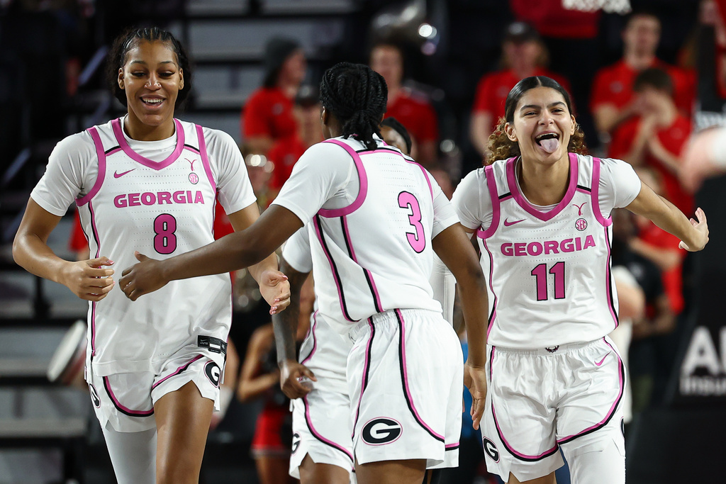 Georgia forward Zhen Craft (8) and guards Dani Carnegie (3) and Enjulina Gonzalez (11) react during the first half of an NCAA college basketball game against Vanderbilt, Sunday, Feb. 15, 2026, in Athens, Ga. (AP Photo/Colin Hubbard)