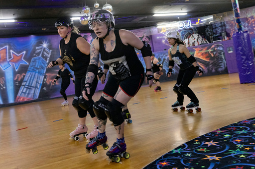 FILE - Members of the Long Island Roller Rebels practice, Mar. 19, 2023, at United Skates of America, in Seaford, NY. (AP Photo/Jeenah Moon, File) FILE - Members of the Long Island Roller Rebels practice, Mar. 19, 2023, at United Skates of America, in Seaford, NY. (AP Photo/Jeenah Moon, File)