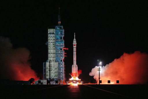 China's Long March 2F rocket, carrying three astronauts for the Shenzhou 21 manned space mission, blasts off at the Jiuquan Satellite Launch Center in Jiuquan, northwestern China, Friday, Oct. 31, 2025. (AP Photo/Andy Wong) China's Long March 2F rocket, carrying three astronauts for the Shenzhou 21 manned space mission, blasts off at the Jiuquan Satellite Launch Center in Jiuquan, northwestern China, Friday, Oct. 31, 2025. (AP Photo/Andy Wong)