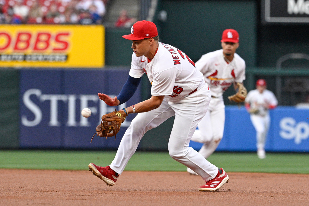 St. Louis Cardinals second baseman JJ Wetherholt fields a ground ball hit by New York Mets' Jorge Polanco in the first inning of a baseball, Monday, March 30, 2026, in St. Louis. (AP Photo/Joe Puetz)