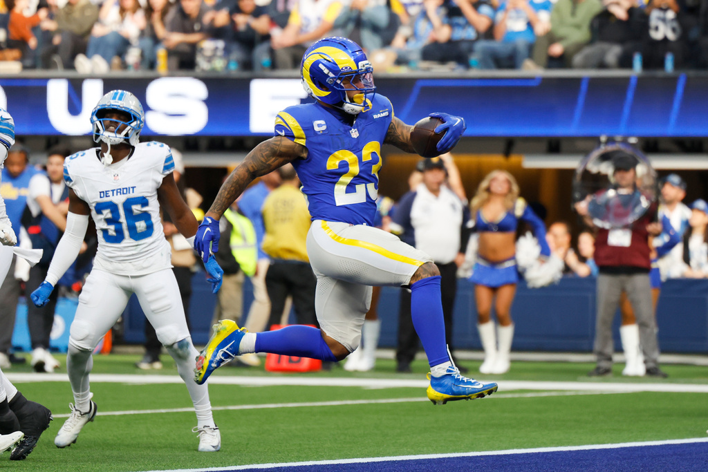 Los Angeles Rams running back Kyren Williams (23) scores a rushing touchdown during the first half of an NFL football game against the Detroit Lions, Sunday, Dec. 14, 2025, in Inglewood, Calif. (AP Photo/Caroline Brehman)