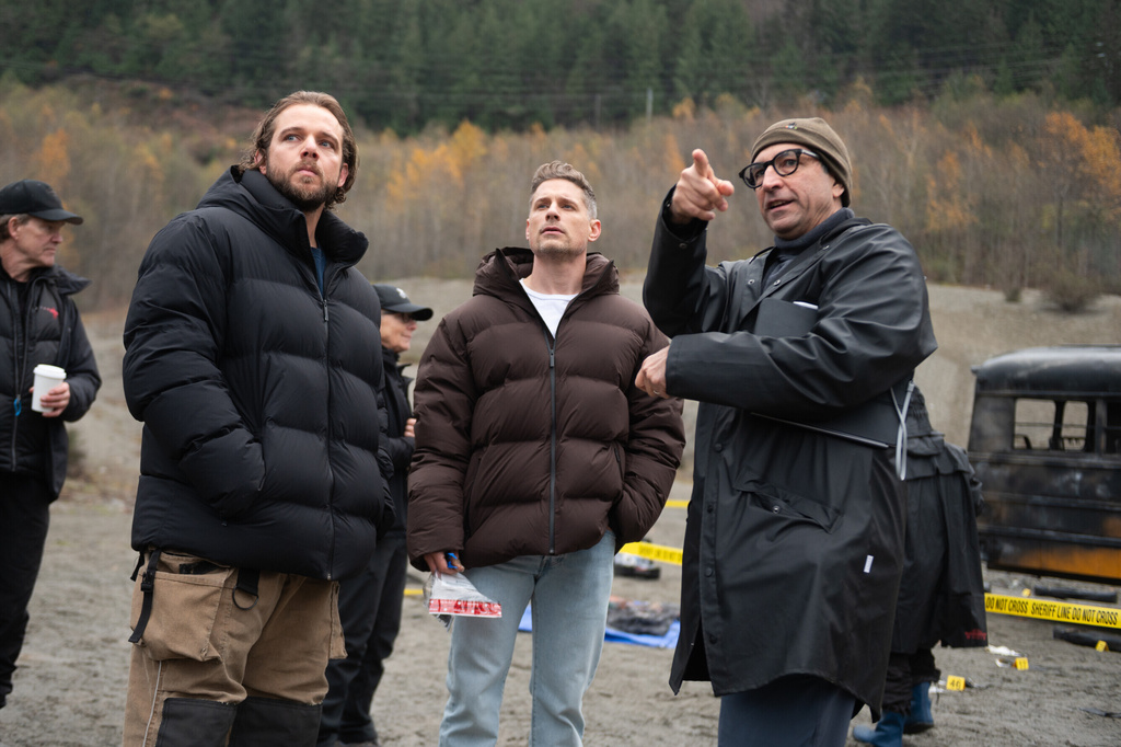 This image released by CBS shows, foreground from left, actor, co-creator and and executive producer Max Thieriot, left, actor Matt Lauria and director Ed Ornelas on the set of "Sheriff Country." (Sergei Bachlakov/CBS via AP)