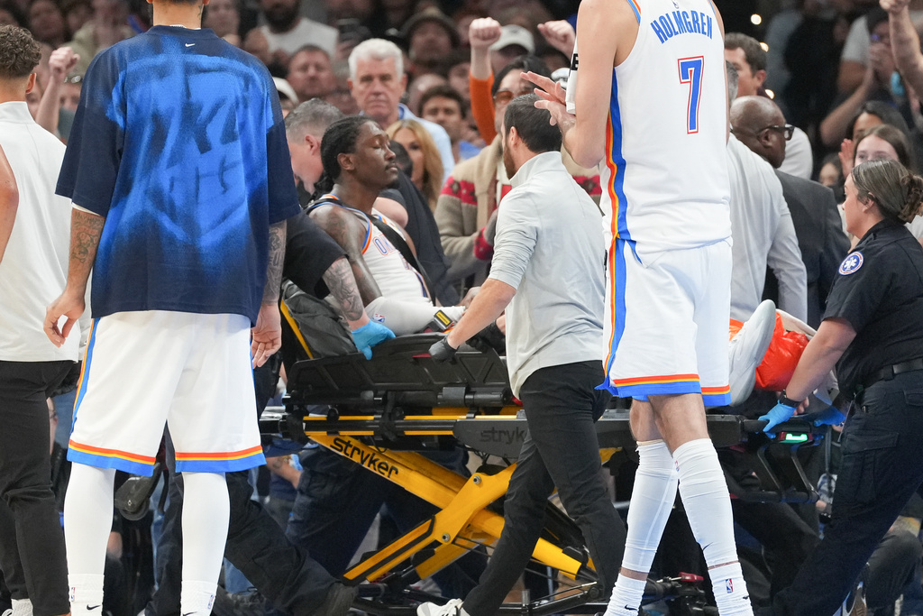Oklahoma City Thunder guard Jalen Williams is taken off the court by medical staff during the second half of an NBA basketball game against the Los Angeles Clippers, Sunday, Oct. 25, 2026, in Oklahoma City. (AP Photo/Kyle Phillips)
