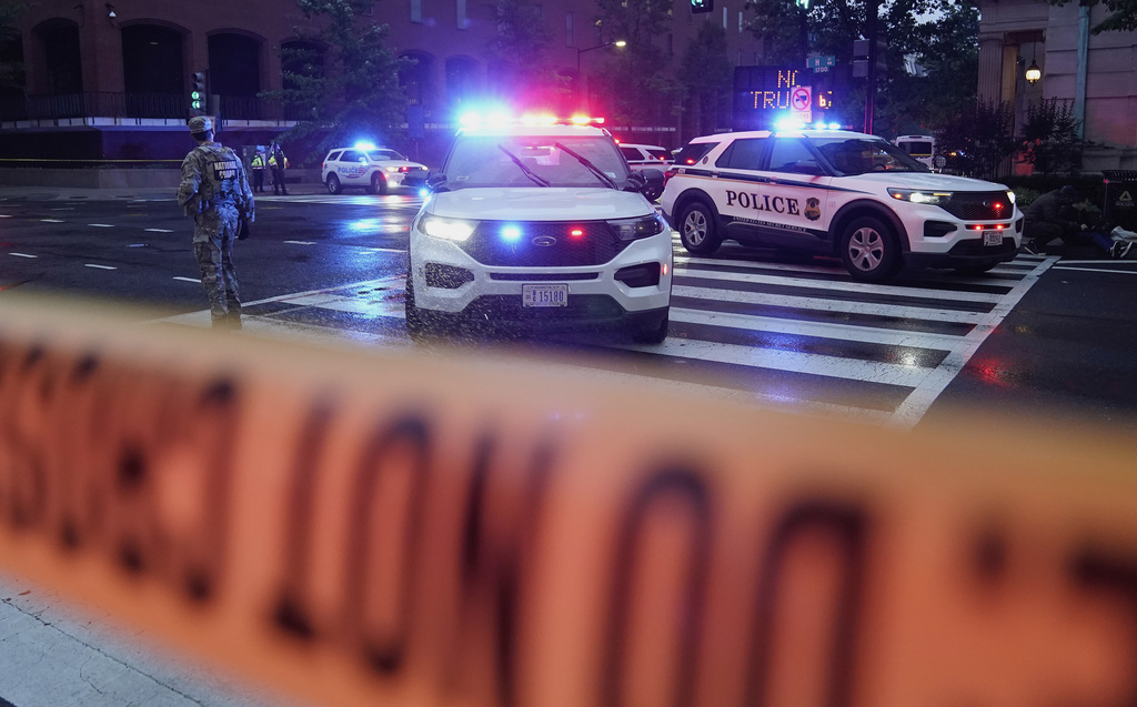 U.S. Secret Service Police are seen on a crime scene after responding to reports of shots fired near the White House, Saturday, May 23, 2026, in Washington. (AP Photo/Jose Luis Magana)