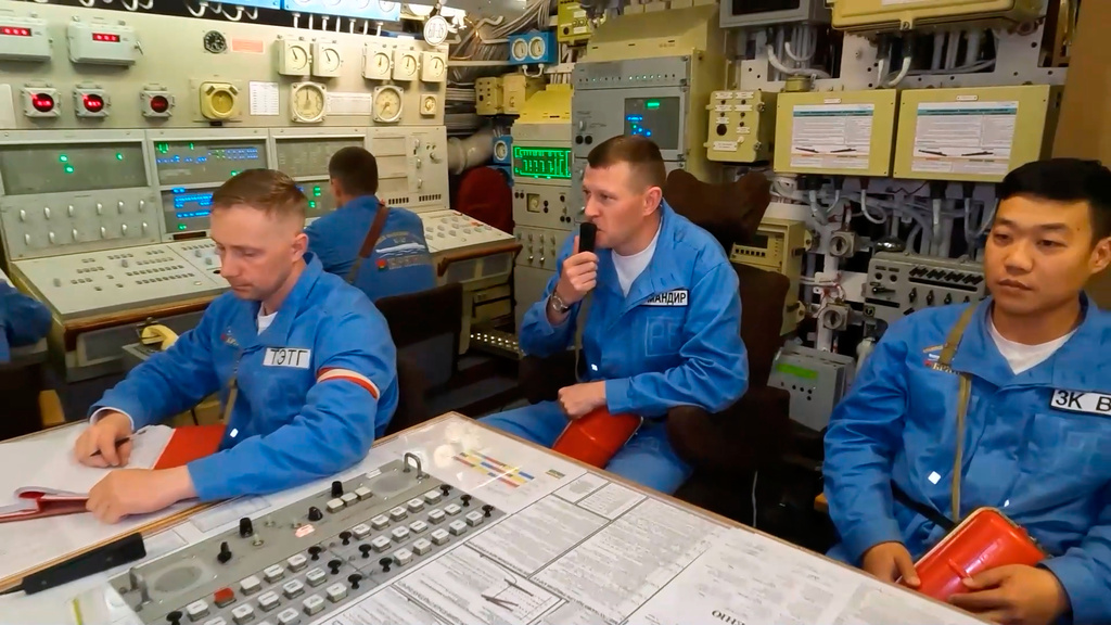 In this photo taken from video distributed by Russian Defense Ministry Press Service on Wednesday, Oct. 22, 2025, the crew of the Bryansk nuclear submarine of the Russian navy prepares to conduct a practice launch of an intercontinental ballistic missile during the drills of Russia's nuclear forces. (Russian Defense Ministry Press Service via AP)