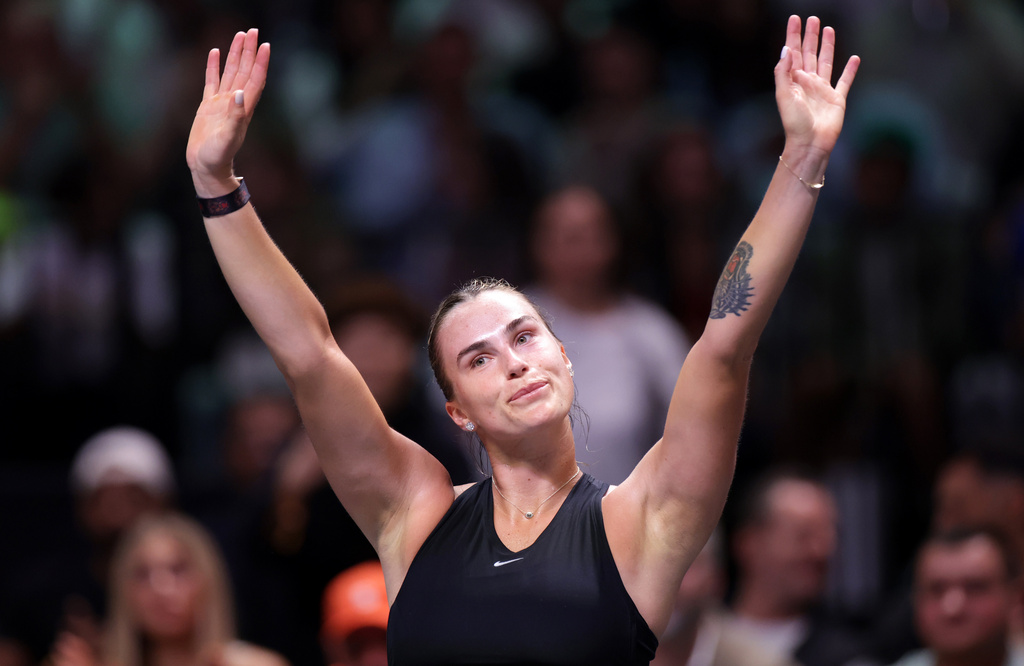 Aryna Sabalenka acknowledges the crowd after losing against Nick Kyrgios in their Battle of the Sexes match, in Dubai, United Arab Emirates, Sunday Dec. 28, 2025. (Christopher Pike/Pool Photo via AP)