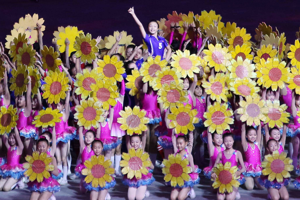 People perform at the May Day Stadium in Pyongyang, North Korea, Thursday, Oct. 9, 2025, during the ceremony marking the 80th anniversary of the founding of the ruling Workers' Party. (AP Photo/Jon Chol Jin)