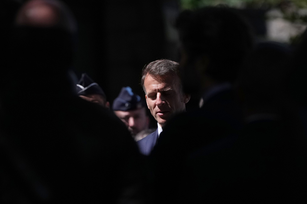 French President Emmanuel Macron visit security force ahead of the G7 summit in Evian-les-Bains, France, Monday, June 15, 2026. (AP Photo/Christophe Ena) CORRECTION: Corrects all details due to copy/paste error