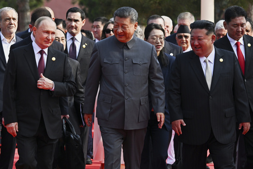 Front from left, Russian President Vladimir Putin, Chinese President Xi Jinping and North Korean leader Kim Jong Un arrive at a military parade to commemorate the 80th anniversary of Japan's World War II surrender in Beijing, China, Wednesday, Sept. 3, 2025. (Sergei Bobylev, Sputnik, Kremlin Pool Photo via AP) Front from left, Russian President Vladimir Putin, Chinese President Xi Jinping and North Korean leader Kim Jong Un arrive at a military parade to commemorate the 80th anniversary of Japan's World War II surrender in Beijing, China, Wednesday, Sept. 3, 2025. (Sergei Bobylev, Sputnik, Kremlin Pool Photo via AP)