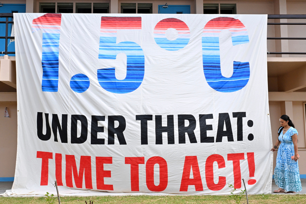A climate change banner is unfurled by Greenpeace during the Pacific Islands Forum Leaders Meeting in Koror, Palau, Wednesday, Sept. 2, 2026. (Mick Tsikas/AAP Image via AP)
