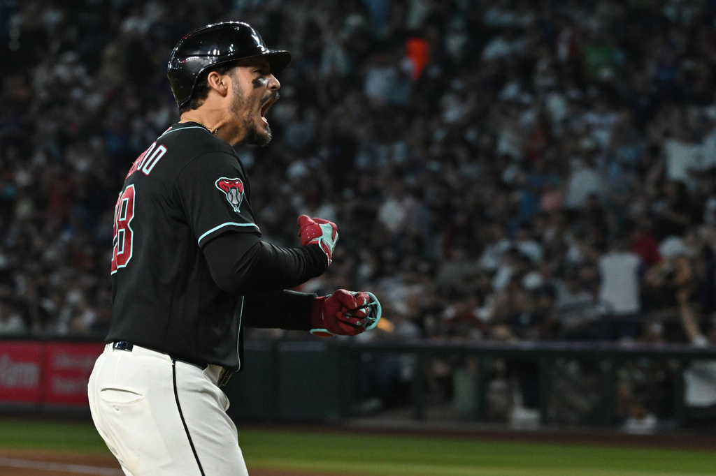 Arizona Diamondbacks' Nolan Arenado celebrates after hitting a grand slam in the fifth inning of a baseball game against the New York Yankees, Sunday, Sept. 20, 2026, in Phoenix. (AP Photo/Caitlin O'Hara)
