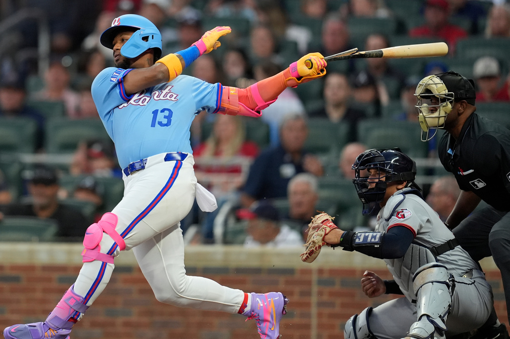Atlanta Braves' Ronald Acuña Jr. (13) hits an RBI-Single in the third inning of a baseball game against the Cleveland Guardians, Friday, April 10, 2026, in Atlanta. (AP Photo/Mike Stewart)