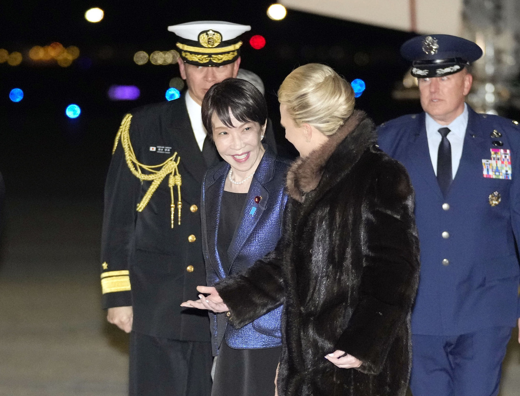 Japanese Prime Minister Sanae Takaichi, center, arrives at Joint Base Andrews, Md. Wednesday, March 18, 2026. (Yuki Sato/Kyodo News via AP)