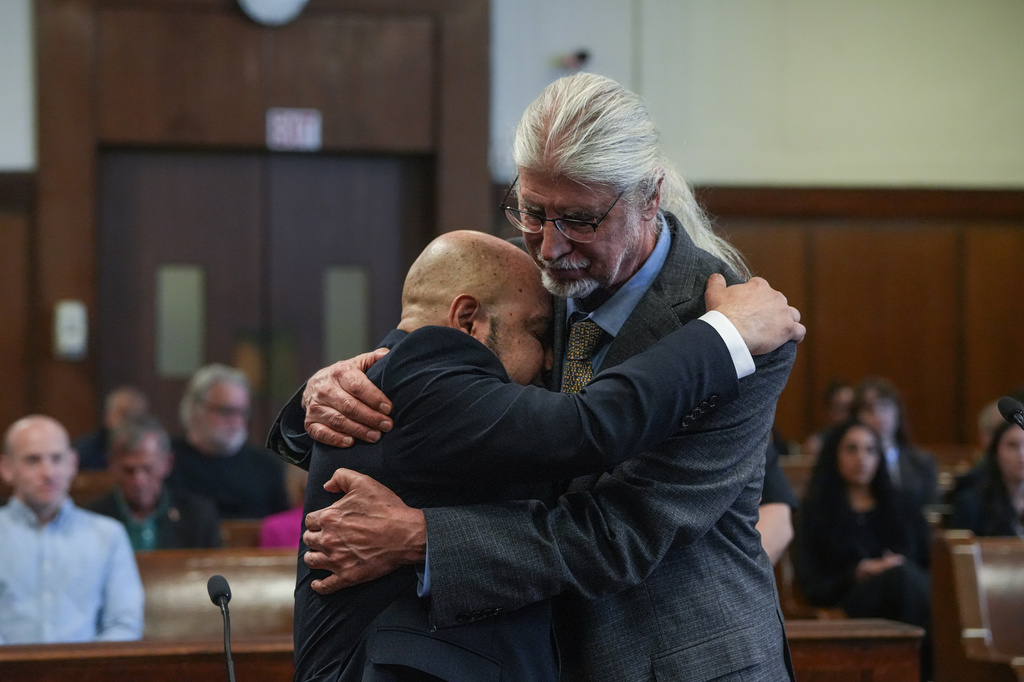 Harry Ruiz hugs his lawyer, Ron Kuby, after a judge in New York vacates his murder conviction on Monday, April 27, 2026. (Dean Moses/amNewYork via AP, Pool)