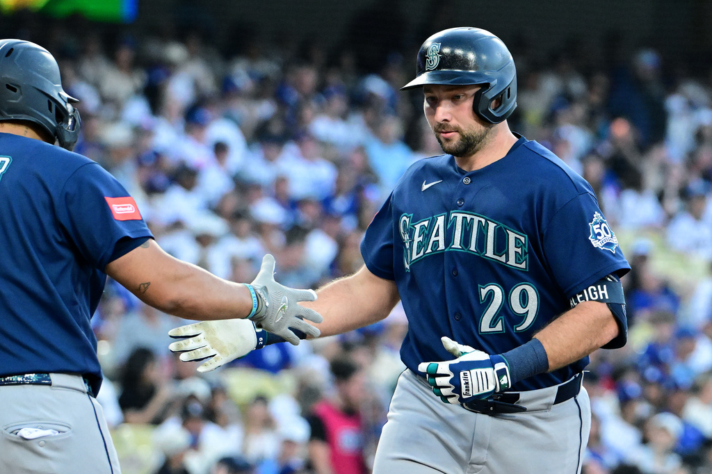 Seattle Mariners Cal Raleigh (29) celebrates his solo home run against the Los Angeles Dodgers during the second inning of a baseball game, Tuesday, July 28 2026, in Los Angeles. (AP Photo/Wally Skalij)