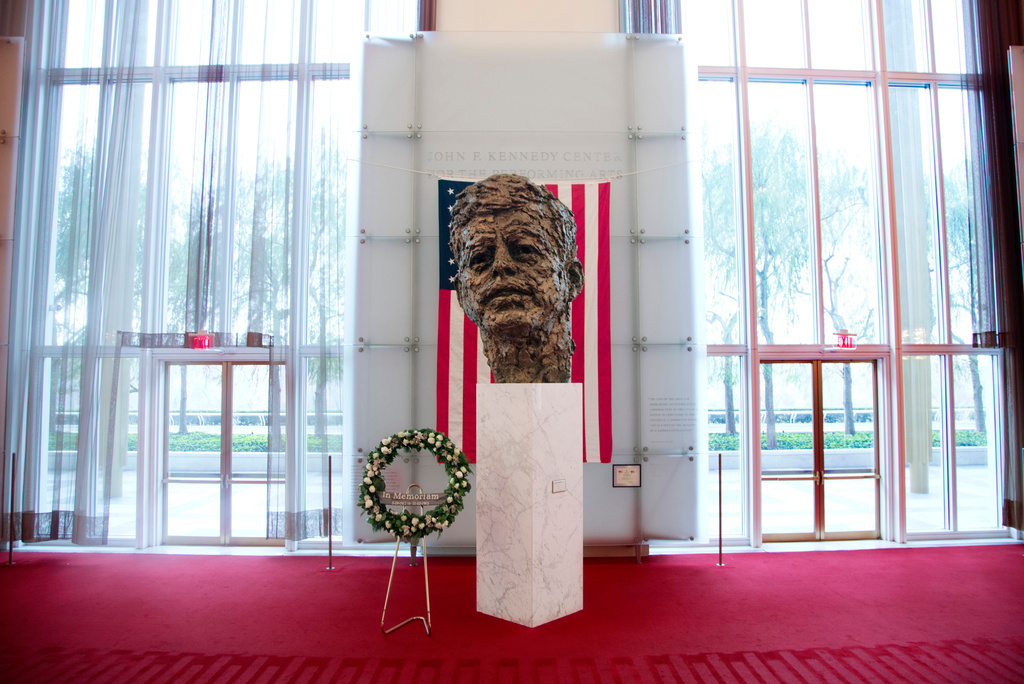 FILE - A memorial wreath stands next to the bronze memorial bust by Robert Berks of President John F. Kennedy in the grand foyer at the John F. Kennedy Center for the Performing Arts in Washington, Nov. 22, 2013, on the 50th anniversary of Kennedy's death. (AP Photo/Carolyn Kaster, File)
