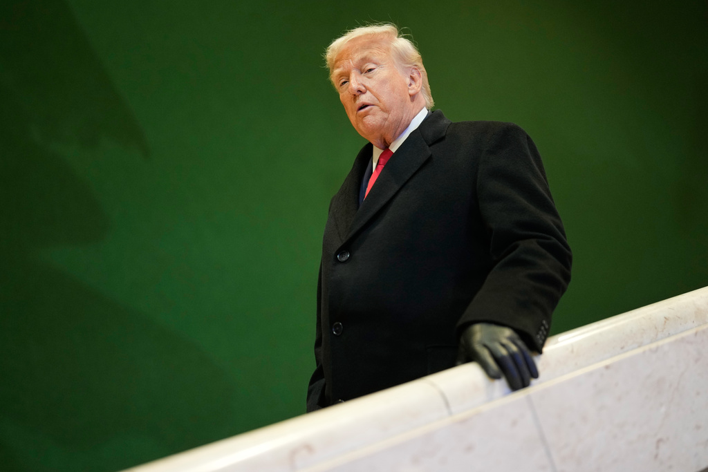 President Donald Trump walks down stairs after a meeting during the Annual Meeting of the World Economic Forum in Davos, Switzerland, Wednesday, Jan. 21, 2026. (AP Photo/Markus Schreiber)