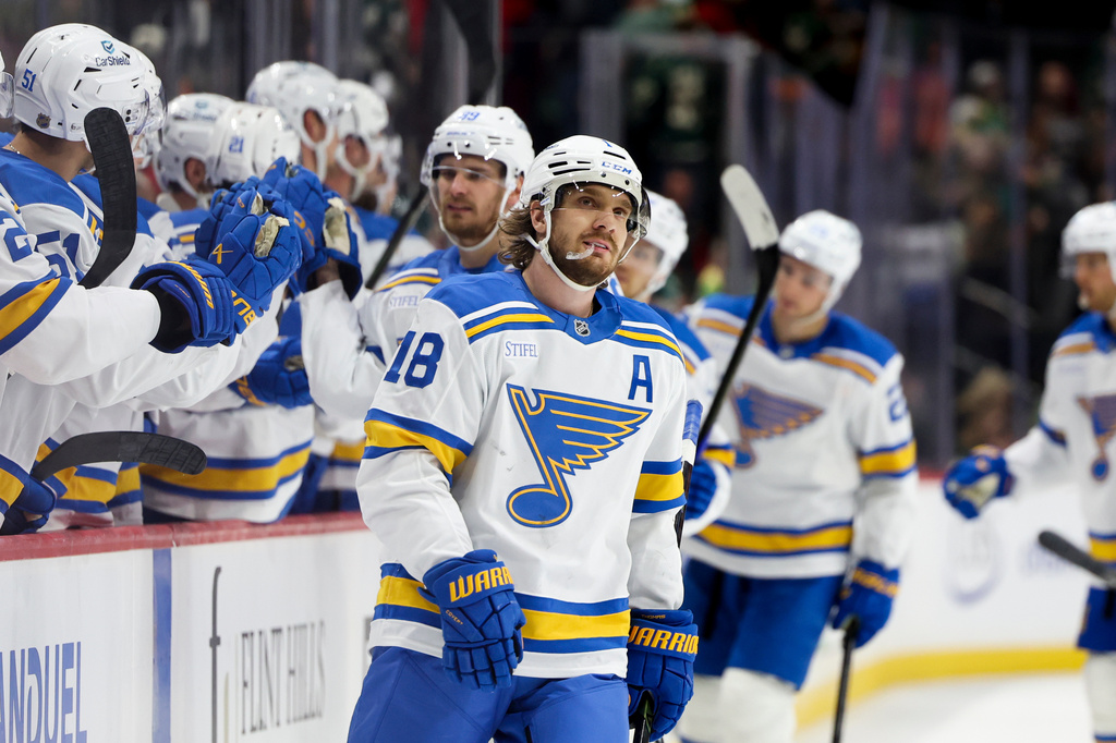 FILE - St. Louis Blues center Robert Thomas reacts after scoring an empty-net goal during the third period of an NHL hockey game against the Minnesota Wild, March 1, 2026, in St. Paul, Minn. (AP Photo/Ellen Schmidt, File)